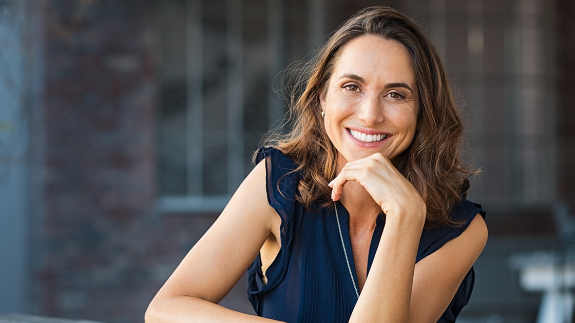 Smiling woman dark blue shirt